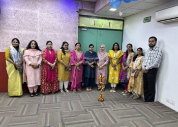 IVS faculty group with a ceremonial lamp